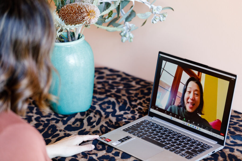 meditation coach and student on laptop talking