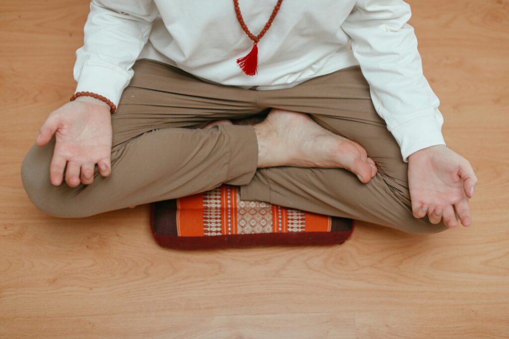man meditating legs crossed