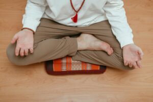 man meditating legs crossed